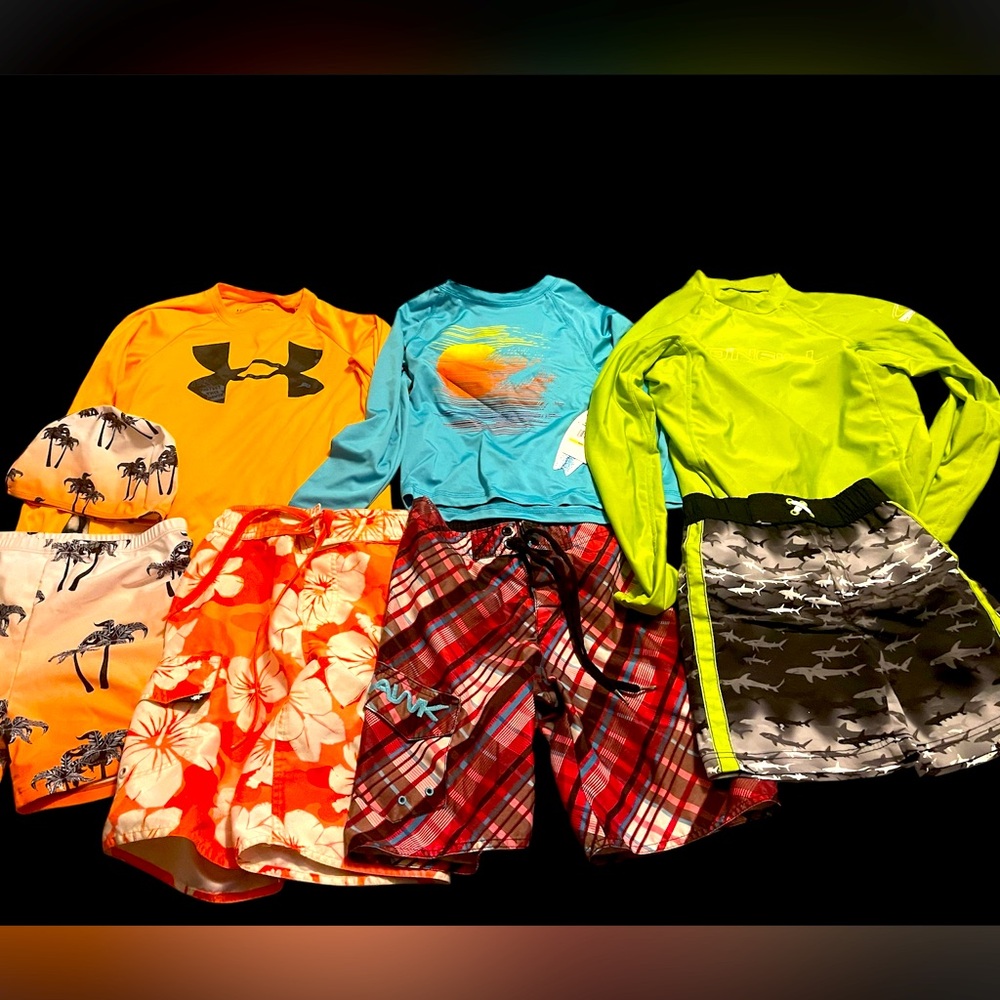 Lot of boys swim trunks and rash-guards